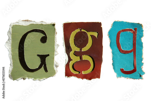 G alphabet torn from a magazine paper. Ransom note style letters.
