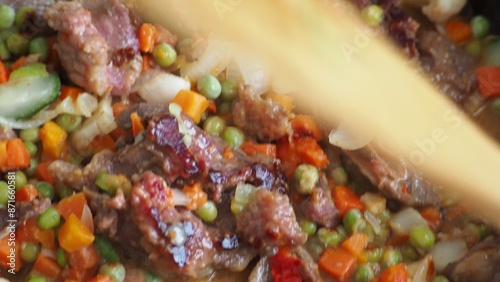 Stir-fry meat and vegetables in an iron skillet. wok stir fry with selective focus