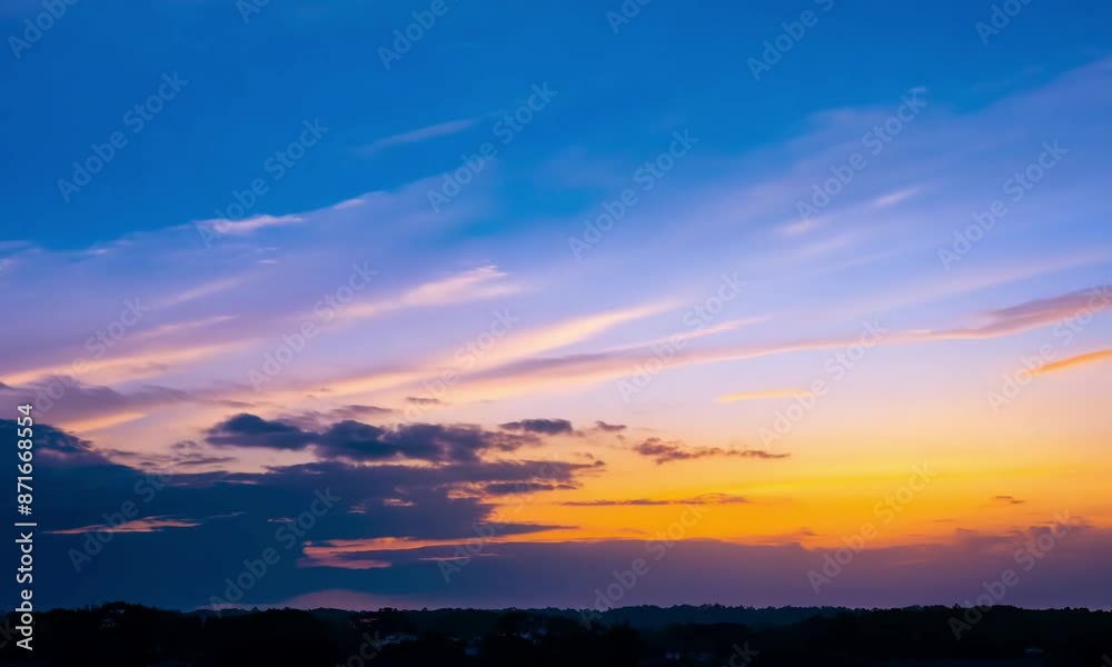 A static timelapse at sunset with a dramatic cloudy sky and contrasty blue and orange glow as the shot dip to black A static timelapse at sunset with a dramatic cloudy sky and contrasty blue and orange glow as the shot dip to black