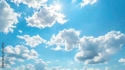 Fototapeta Naklejka Na Ścianę i Meble -  Sunny summer day with clear blue skies and fluffy clouds