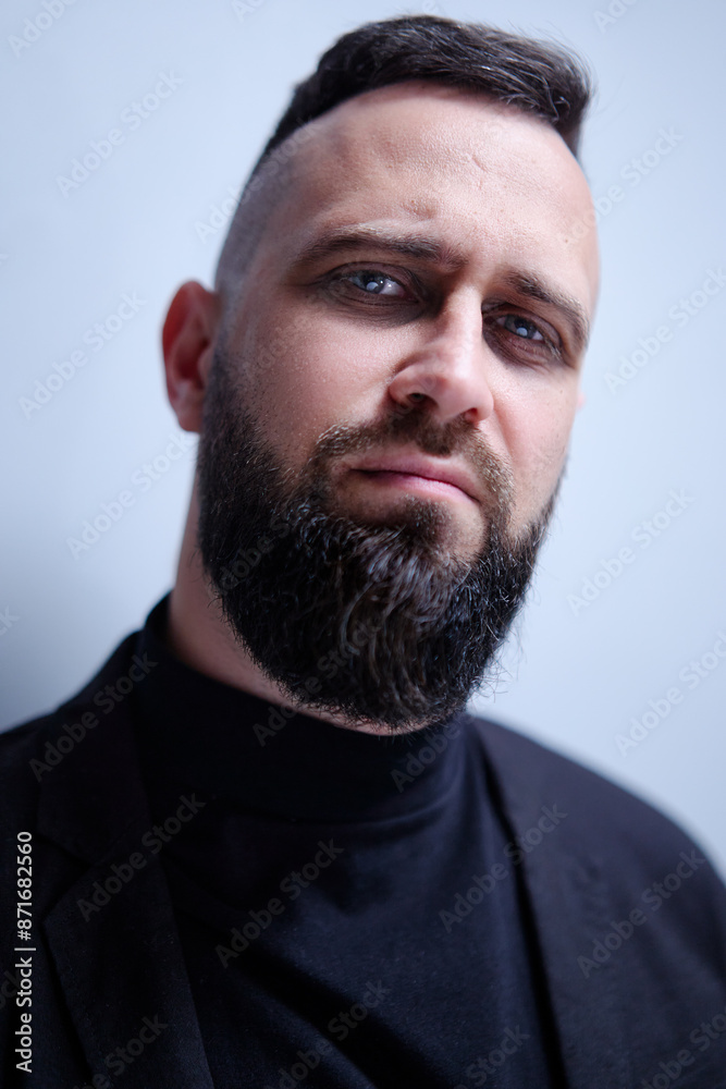 Obraz premium Studio portrait of young handsome man with beard.