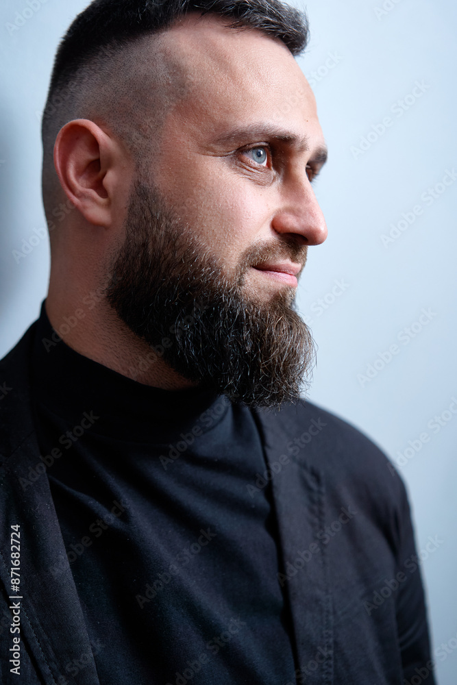 Studio portrait of young handsome man with beard. Studio portrait of young handsome man with beard.