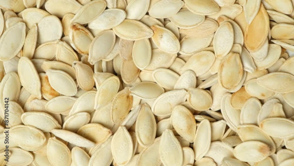 Unpeeled Roasted Pumpkin Seeds Pouring, Slow Motion Unpeeled Roasted Pumpkin Seeds Pouring, Slow Motion