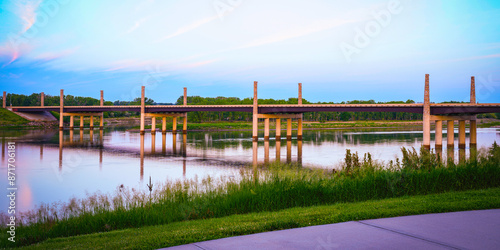 Discovery Bridge across the Missouri River in Yankton connecting Nebraska and South Dakota of the United States: The beautiful sunrise landscape in summer photo