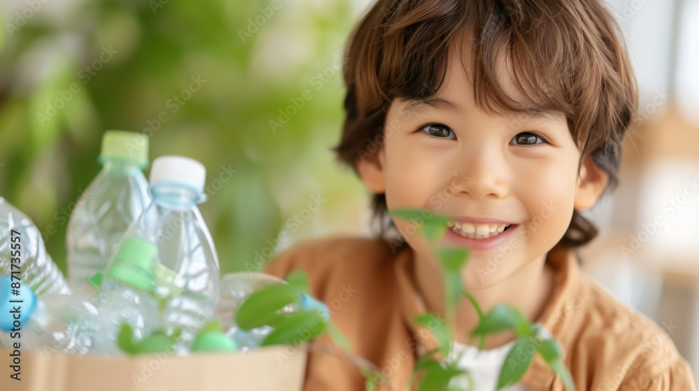 Cute small boy sitting near recycle bin and smiling Cute small boy sitting near recycle bin and smiling
