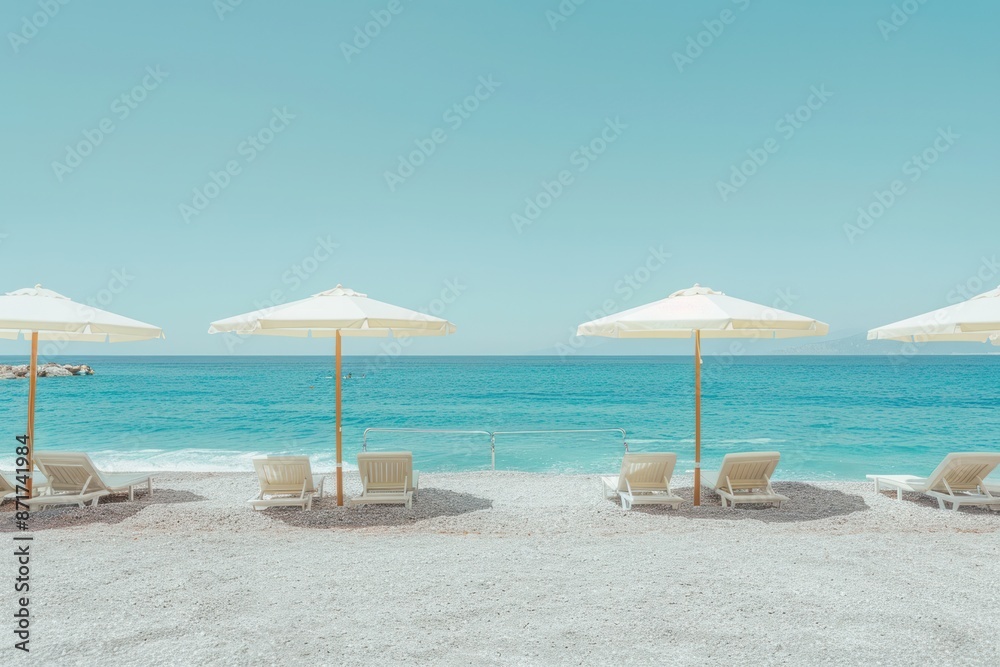 A beach scene with four white umbrellas and several white chairs A beach scene with four white umbrellas and several white chairs