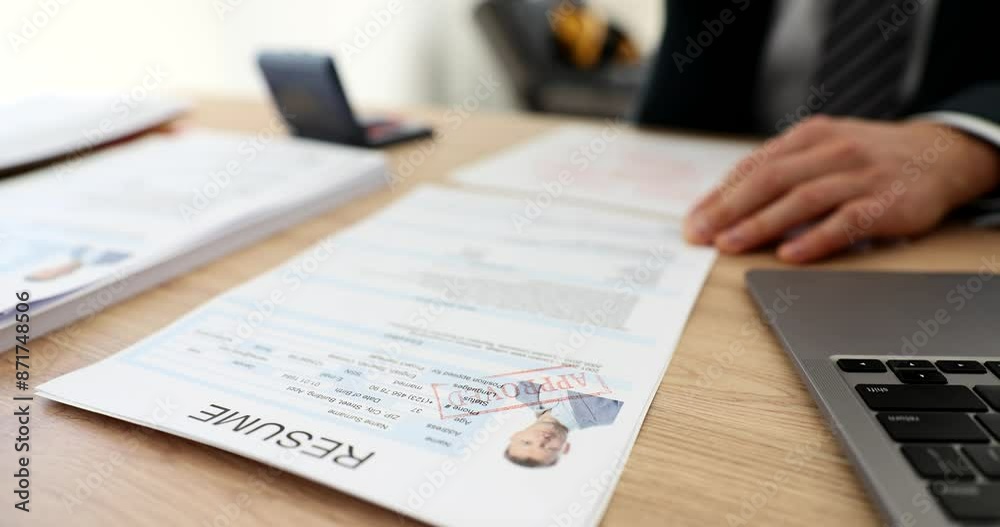 Manager hand stamping approved on employee resume in office closeup 4k movie slow motion. Employment concept Manager hand stamping approved on employee resume in office closeup 4k movie slow motion. Employment concept