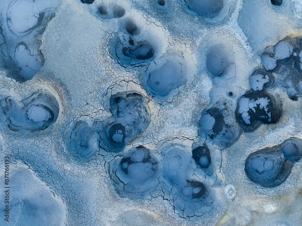 View from above, stunning aerial view of Námafjall Geothermal Area also known as Hverir with smoking fumaroles and boiling mud pots, surrounded by sulphur crystals of many different colours, Iceland.