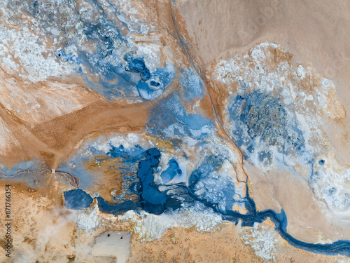 View from above, stunning aerial view of Námafjall Geothermal Area also known as Hverir with smoking fumaroles and boiling mud pots, surrounded by sulphur crystals of many different colours, Iceland.