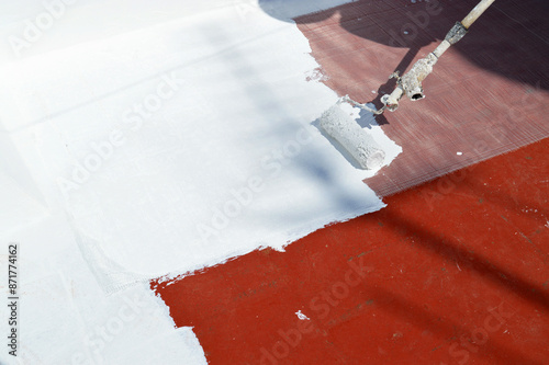 Waterproofing the house terrace with white rubber waterproof coating paint. Waterproof Anti-Leaking Sealant paint