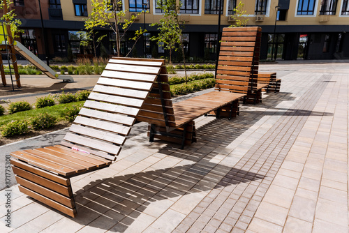 Fototapeta Discover the latest wooden benches designed for urban outdoor spaces, providing