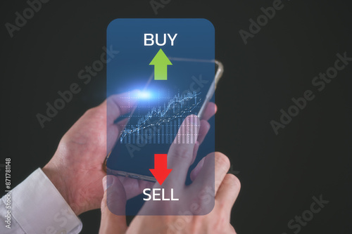 Stock market or forex trading graph and candlestick chart suitable for financial investment concept, businessman using smartphone and computer working with stock market data chart buy and sell
