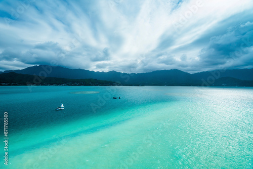 Aerial view of tranquil Sandbar Milky Water with boats, Hawaii, United States. photo