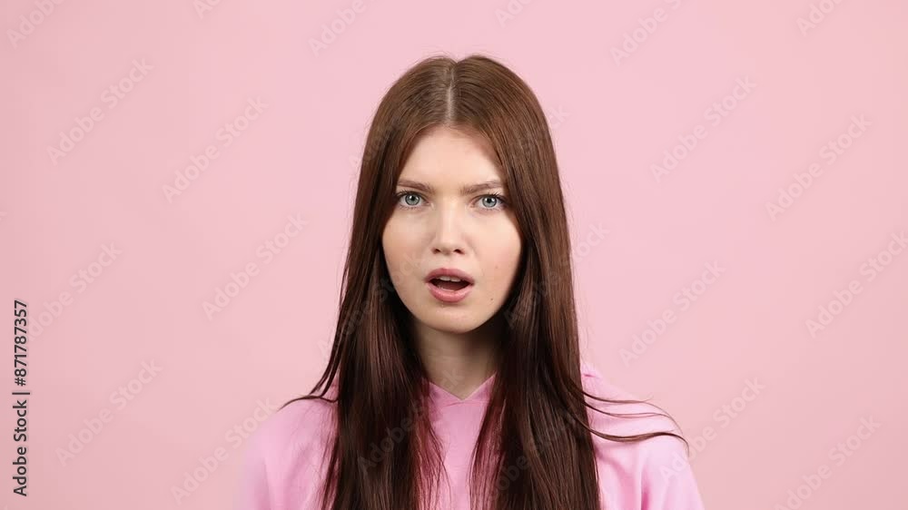 Surprised woman on pink, slow motion Surprised woman on pink, slow motion