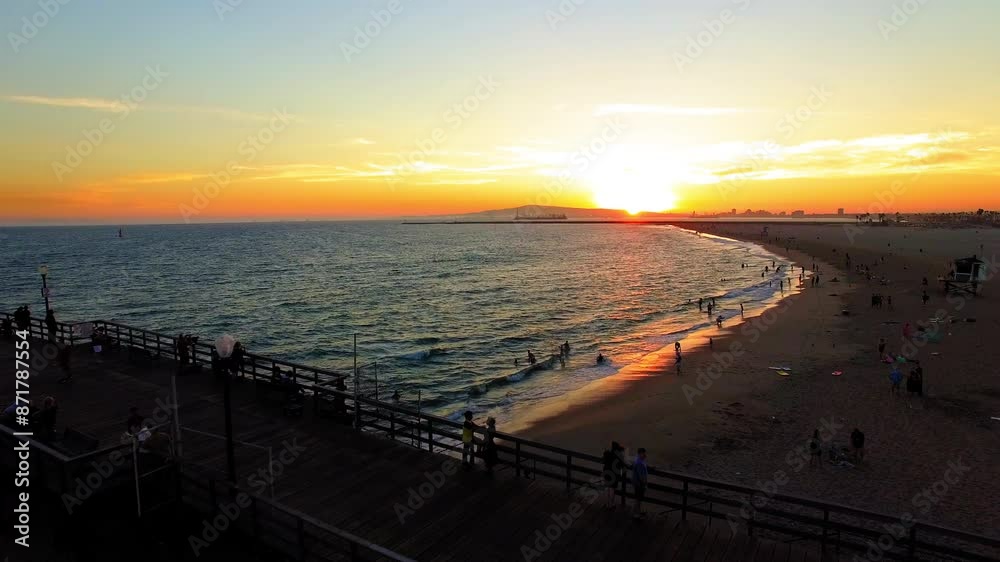 Aerial: Drone Forward Shot Of People On Fishing Pier At Sea Coastline During Sunset - Los Angeles, California Aerial: Drone Forward Shot Of People On Fishing Pier At Sea Coastline During Sunset - Los Angeles, California