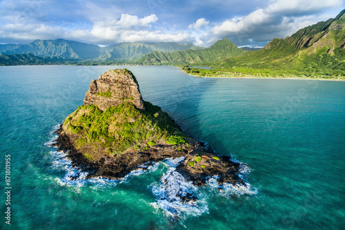 Aerial view of Chinamans Shadow with serene ocean and tropical mountains, Hawaii, United States. photo