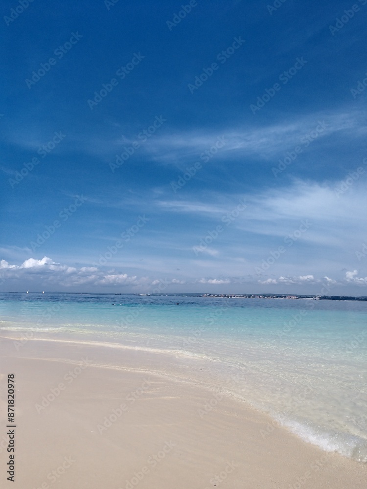 Fototapeta premium the sea under a blue cloudy sky. Beach, summer, clean blue water