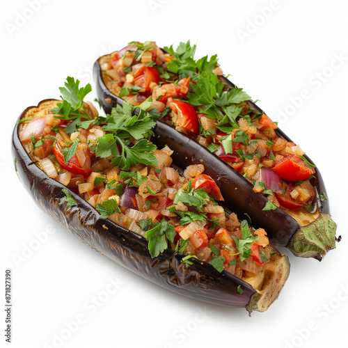 A serving of Turkish imam bayildi, stuffed eggplant with tomatoes, onions, and garlic, garnished with fresh parsley, isolated on white background. photo