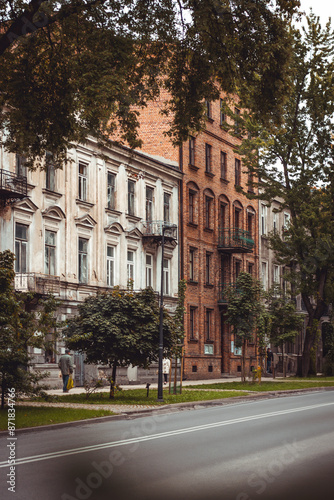 Charming street scene in Radom, Poland, with historic buildings, lush trees