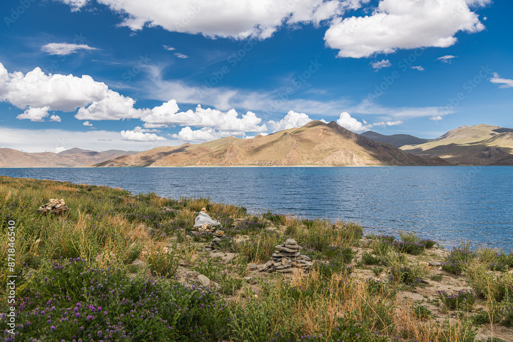 Lake Yamdrok Yumtco - one of the three sacred Tibet lakes, blue sky with copy space for text Lake Yamdrok Yumtco - one of the three sacred Tibet lakes, blue sky with copy space for text