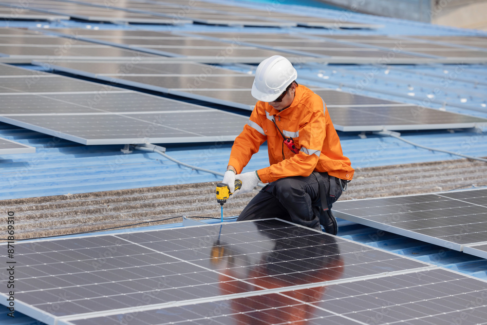 Engineer repair solar panel on the factory rooftop Engineer repair solar panel on the factory rooftop