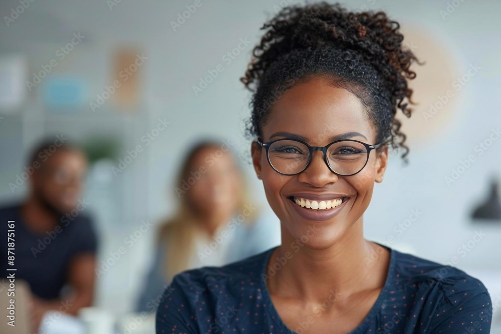 African American business leader with glasses and infectious laughter guides team collaboration in modern office meeting African American business leader with glasses and infectious laughter guides team collaboration in modern office meeting
