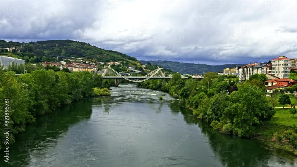 Modern Bridge Over River in Scenic Town Modern Bridge Over River in Scenic Town
