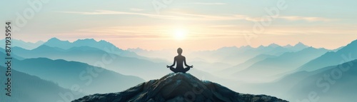 A person meditating on a mountain peak at sunrise, surrounded by misty mountains, reflecting serenity and peace. © HDP-STUDIO