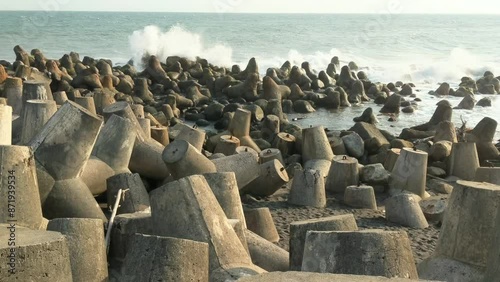 The crashing waves of the Indian Ocean crashing on the wave-breaking tetrapods on the beach of Glagah Kulon Progo, Yogyakarta.
 photo