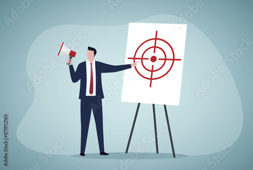 Clarify objective or target, focus or concentrate on purpose to win business mission, perfection or aiming at target concept, businessman pointing at center of bullseye archery target.