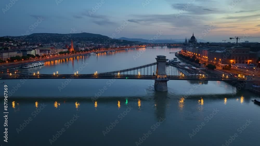 Budapest aerial view at night, aerial view of Danube river with evening illumination, Houses of Parliament in Budapest with night illumination Budapest aerial view at night, aerial view of Danube river with evening illumination, Houses of Parliament in Budapest with night illumination