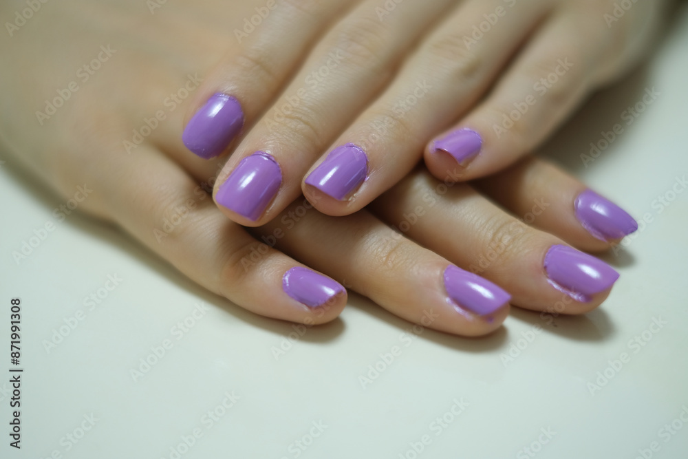 Close-up of hand nails. Close-up of hand nails with purple nail polish. Personal care Beauty and elegance. Close-up of hand nails. Close-up of hand nails with purple nail polish. Personal care Beauty and elegance.