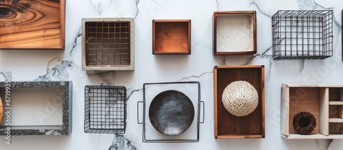 Aerial view of diverse hikidashi boxes and wire baskets for organizing, arranged on a white marble surface with a backdrop for a copy space image. photo