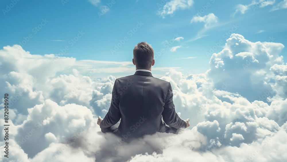 Fototapeta premium Businessman Practicing Meditation Above the Clouds