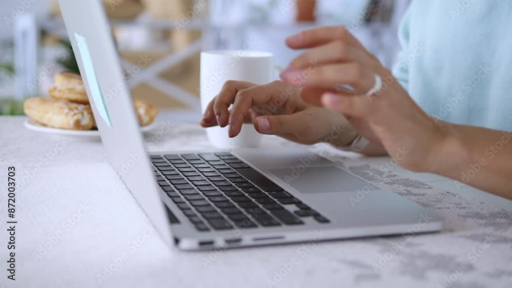 Person sits at desk typing on laptop keyboard close-up on hands computer work typing skills. Close-up of hands typing on laptop keyboard working at desk person using computer work on laptop. Person sits at desk typing on laptop keyboard close-up on hands computer work typing skills. Close-up of hands typing on laptop keyboard working at desk person using computer work on laptop.