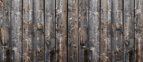 Weathered old wooden fence with vertical boards texture providing copy space image. photo