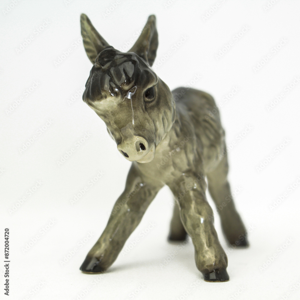 Fototapeta premium Porcelain donkey isolated on a white back