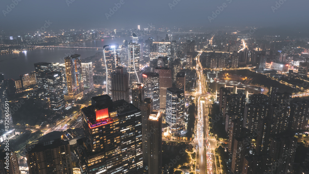 Obraz premium Majestic Night Cityscape with Illuminated Skyline