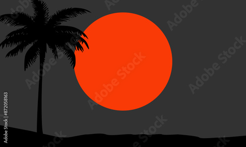 Silhouette of a coconut tree in the evening sunset