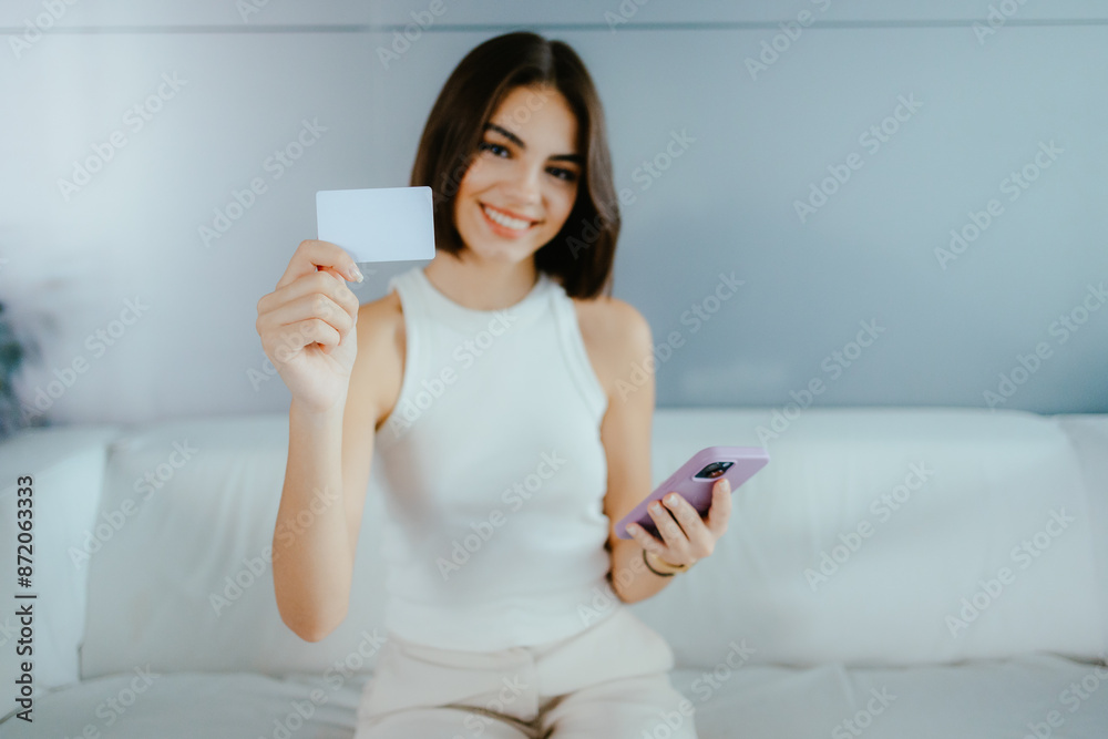 Woman Holding Credit Card and Smartphone Woman Holding Credit Card and Smartphone