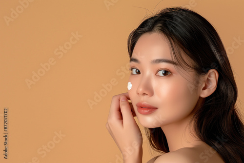 a Young Asian Woman Using Beauty Products