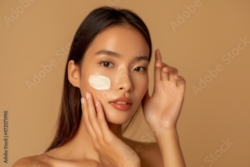 a Young Asian Woman Using Beauty Products