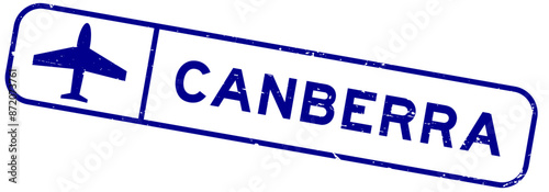 Grunge blue canberra word with plane icon square rubber seal stamp on white background