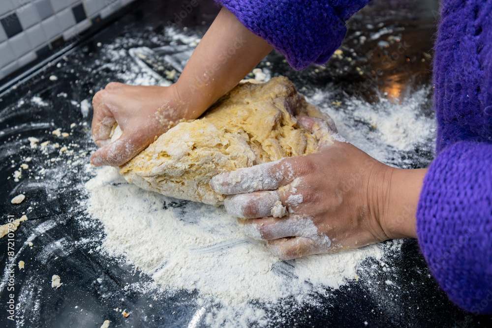 Hands kneading dough buns on the table Hands kneading dough buns on the table