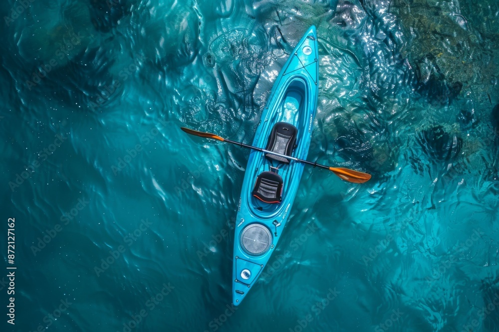 Fototapeta premium Aerial View of Blue Kayak on Clear Waters