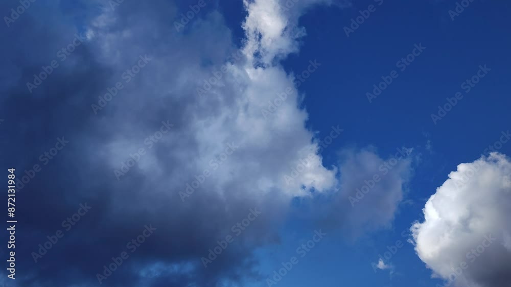 The curious cumulus clouds leave and another large cloud covers everything at twilight The curious cumulus clouds leave and another large cloud covers everything at twilight