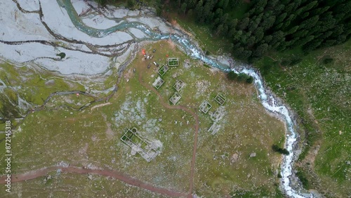 Drone Aerial Shot Approach to Tropical Water stream with a beautiful small creek in a forest, Taip Meadows, Swat Valley, Pakistan. photo