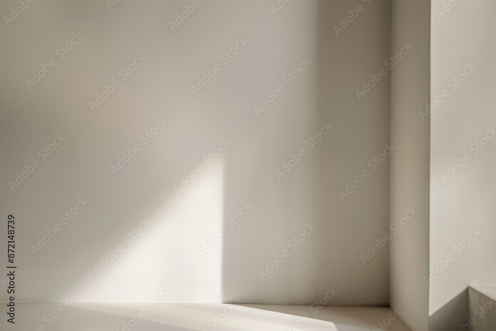 Obraz premium Modern Minimalist Interior, Sunlit Room Corner with Clean White Walls and Subtle Shadows