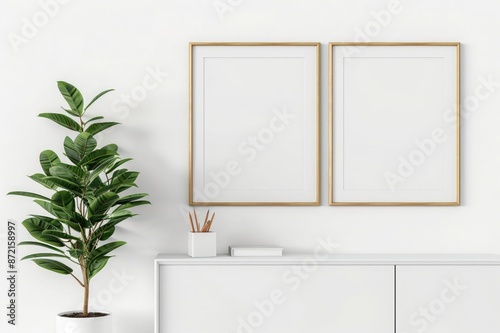 Minimalist mockup of two wooden frames on a white wall with a white cabinet and a green plant