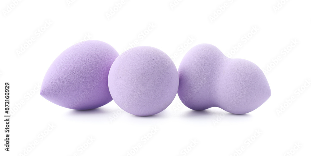 Three violet makeup sponges isolated on white Three violet makeup sponges isolated on white